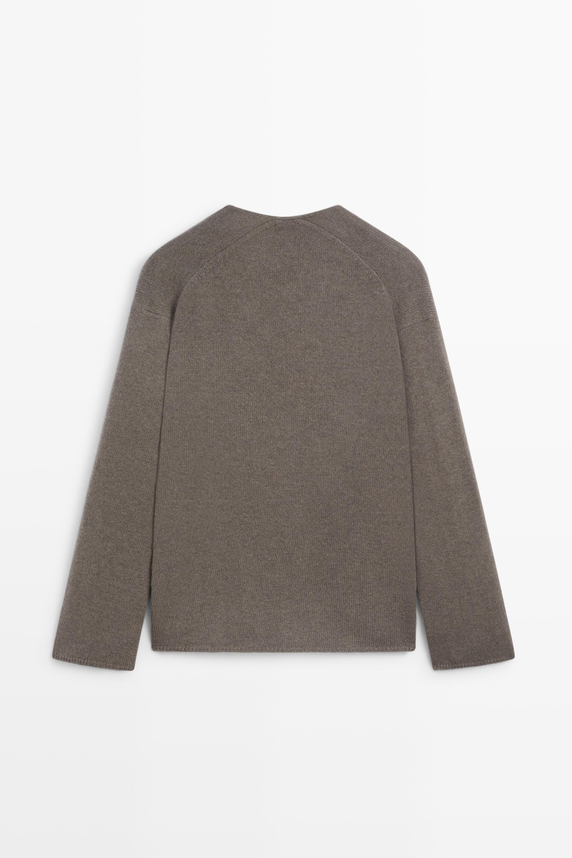 Long-line knit sweater with neckline detail